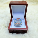 Elegant presentation of Oklahoma City Thunder Championship Ring 2025 Replica, designed for NBA fans and collectors. Championship ring in a wooden box on a fluffy white surface