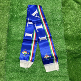 Blue scarf with Italian flag design on a green grass background