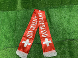 Switzerland scarf with white cross and 'Switzerland' text on a green grass background